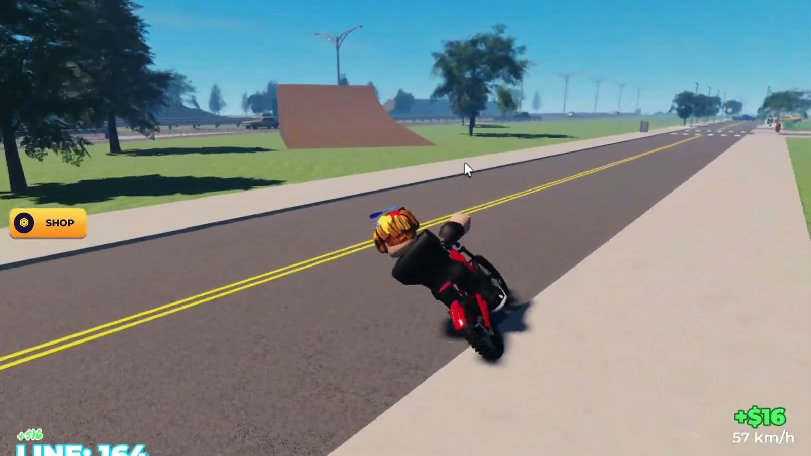 A rider near a long road that runs out toward wind turbines in Bike Universe